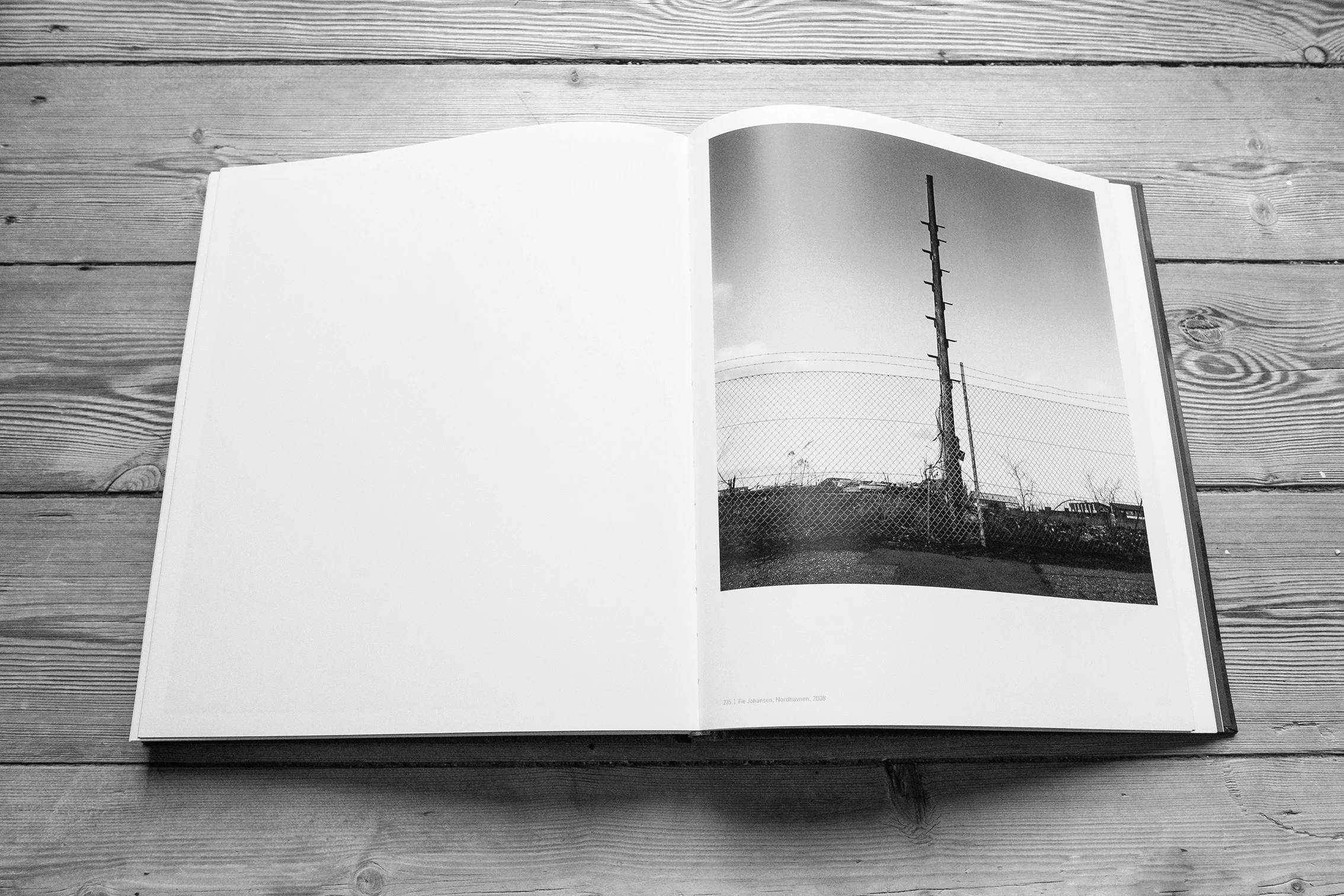 Book spread with a tall industrial structure