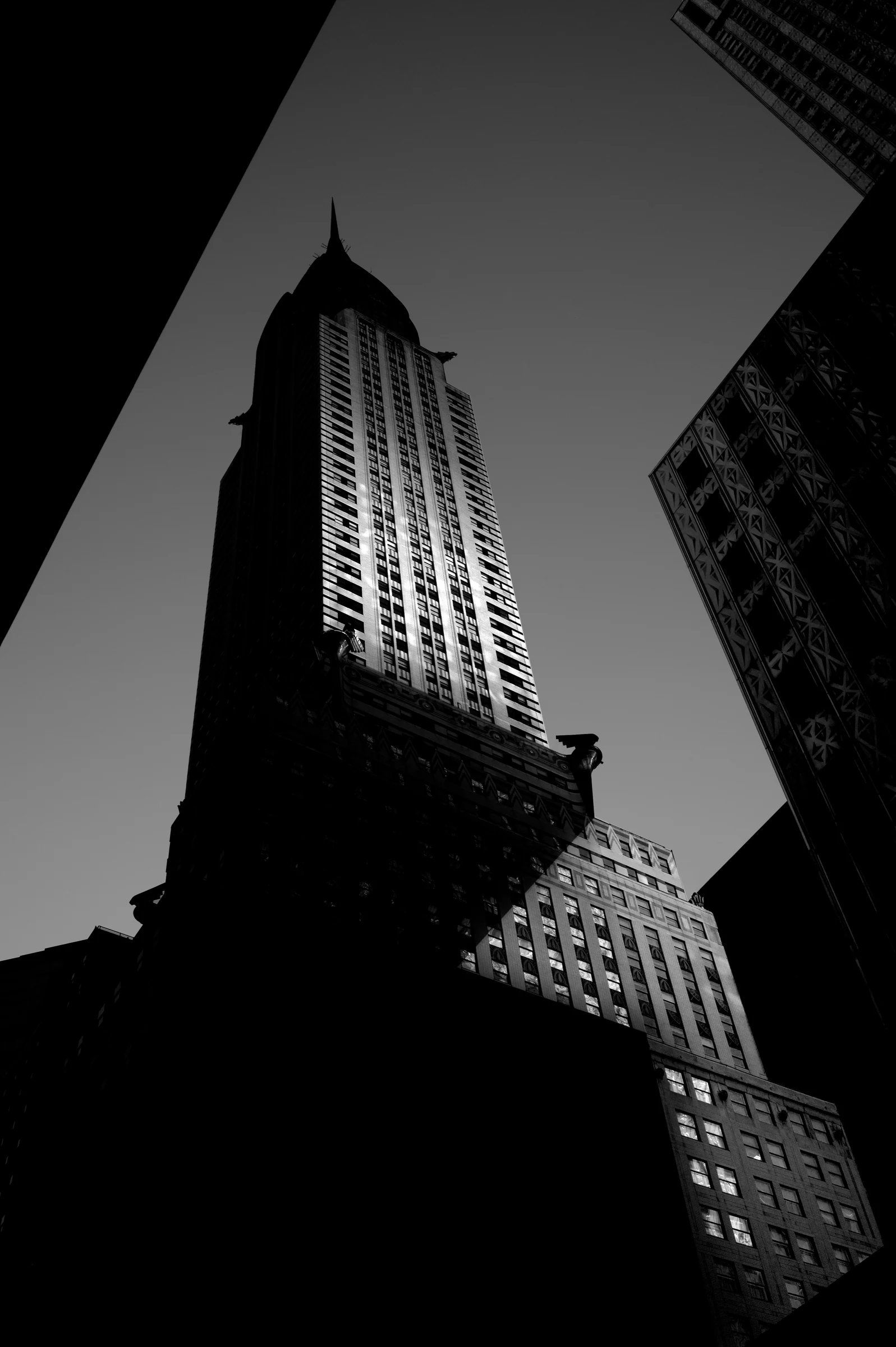 Chrysler Building framed by nearby buildings