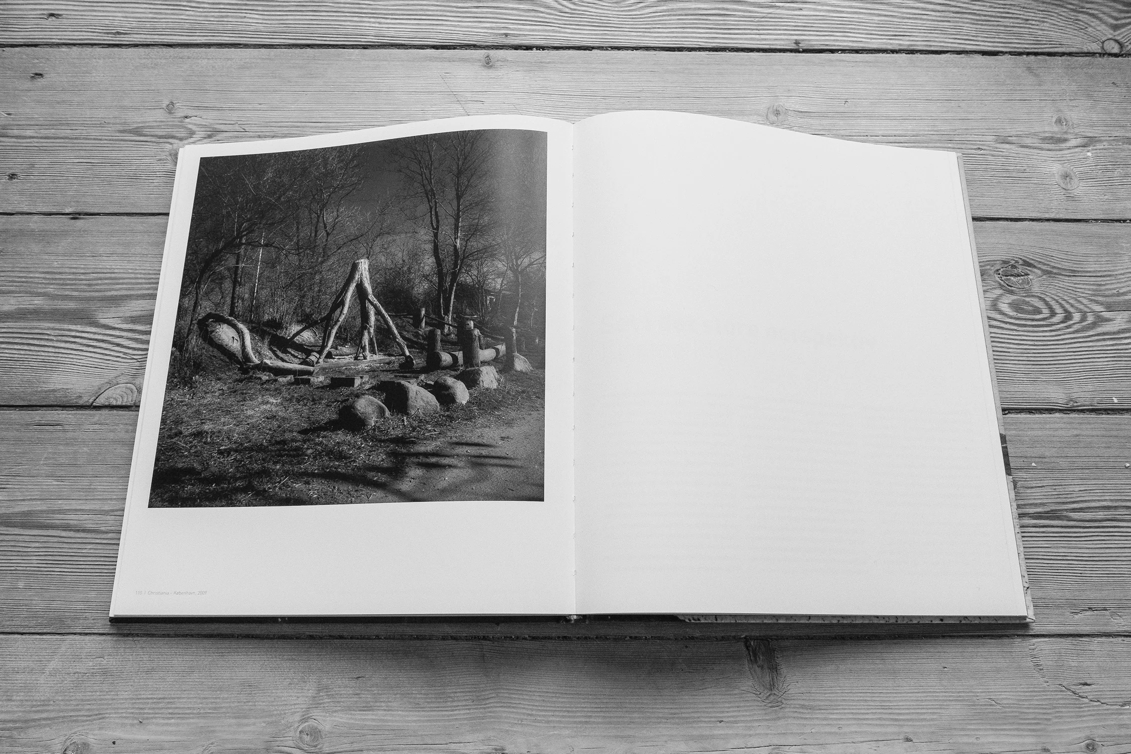 Book spread with a geometric structure in sand