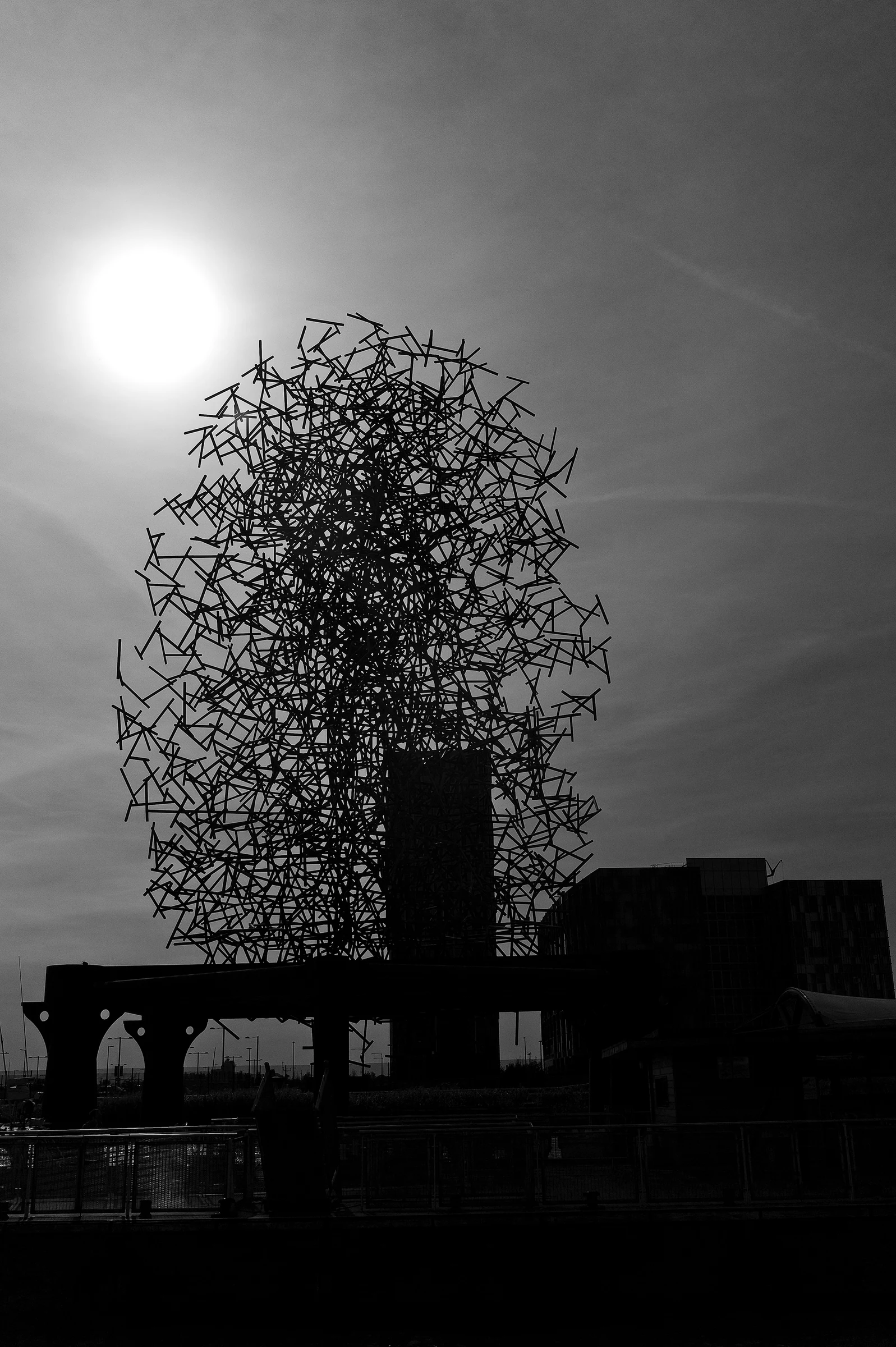 Quantum Cloud sculpture against the sun